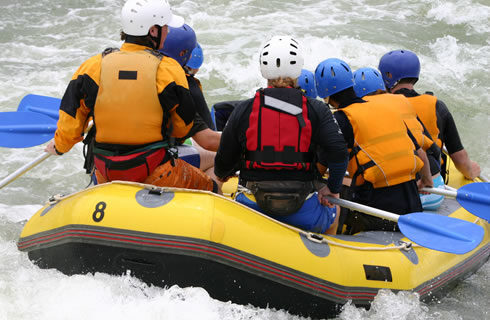 Picture of people whitewater rafting.