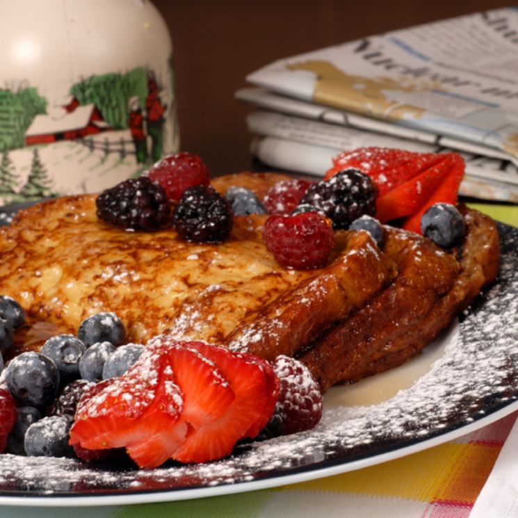 French toast on a page with berries